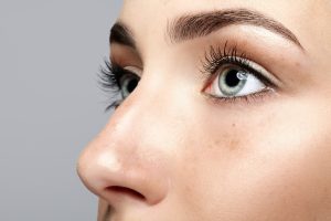 Woman with bright eyes after eyelid surgery in Beverly Hills, CA